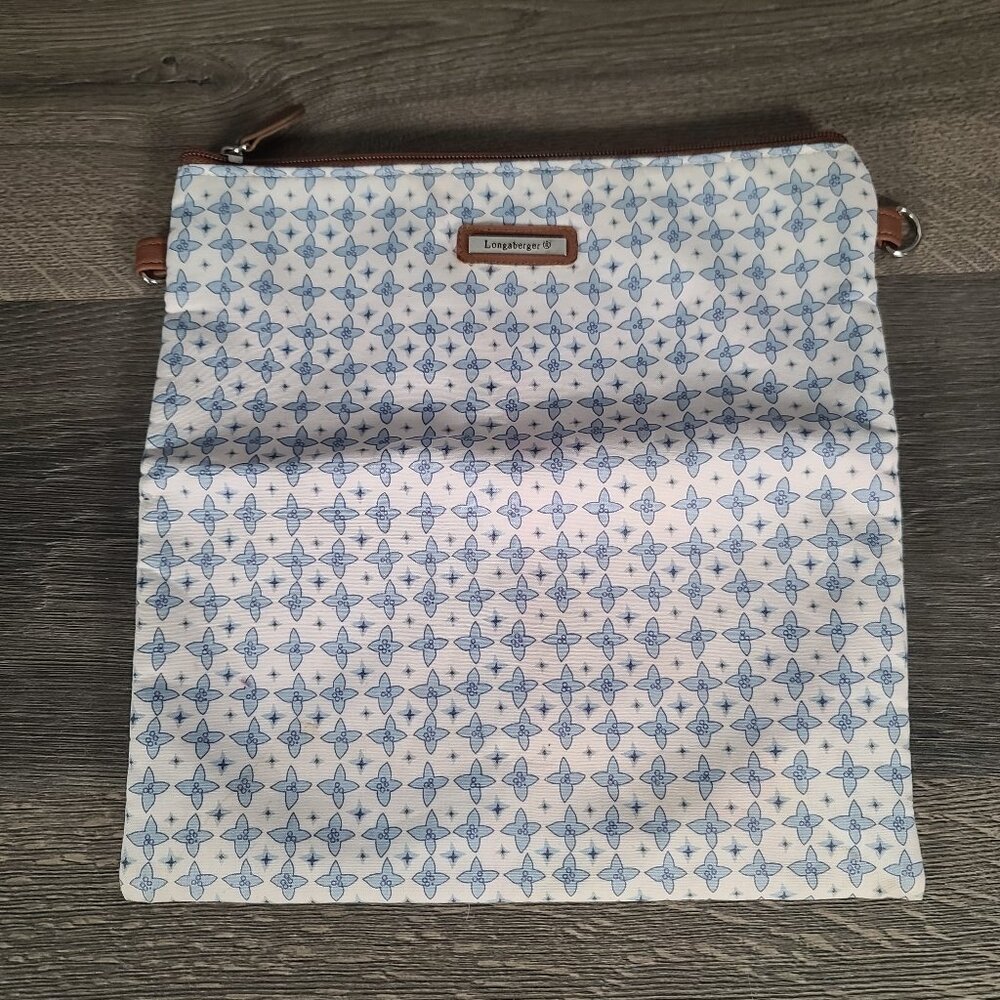 Longaberger crossbody bag in a light blue and white pattern with purse straps
